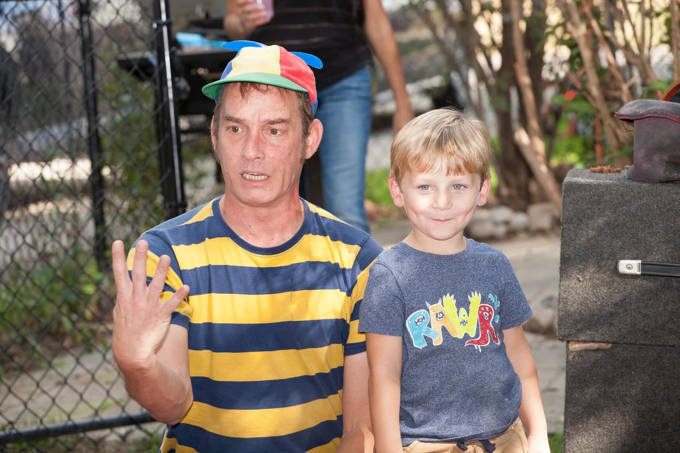 Mr. Twisty performing magic with a child