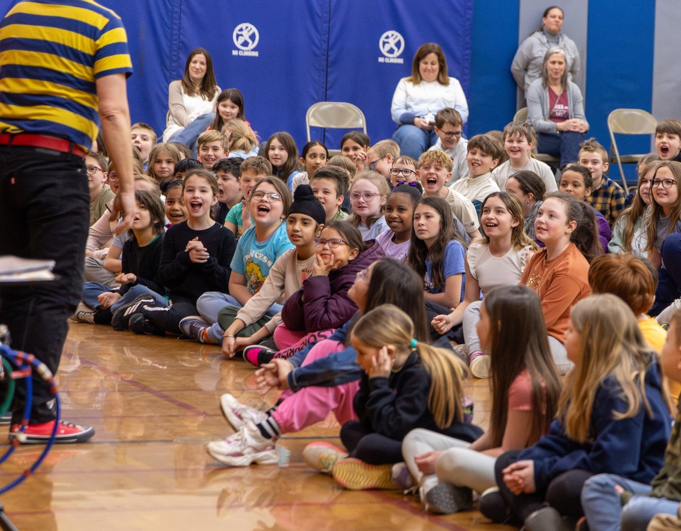 Kids laughing at a library show